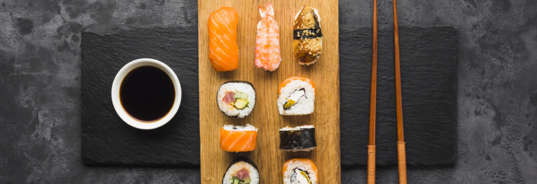 top-view-sushi-plating-slate-background